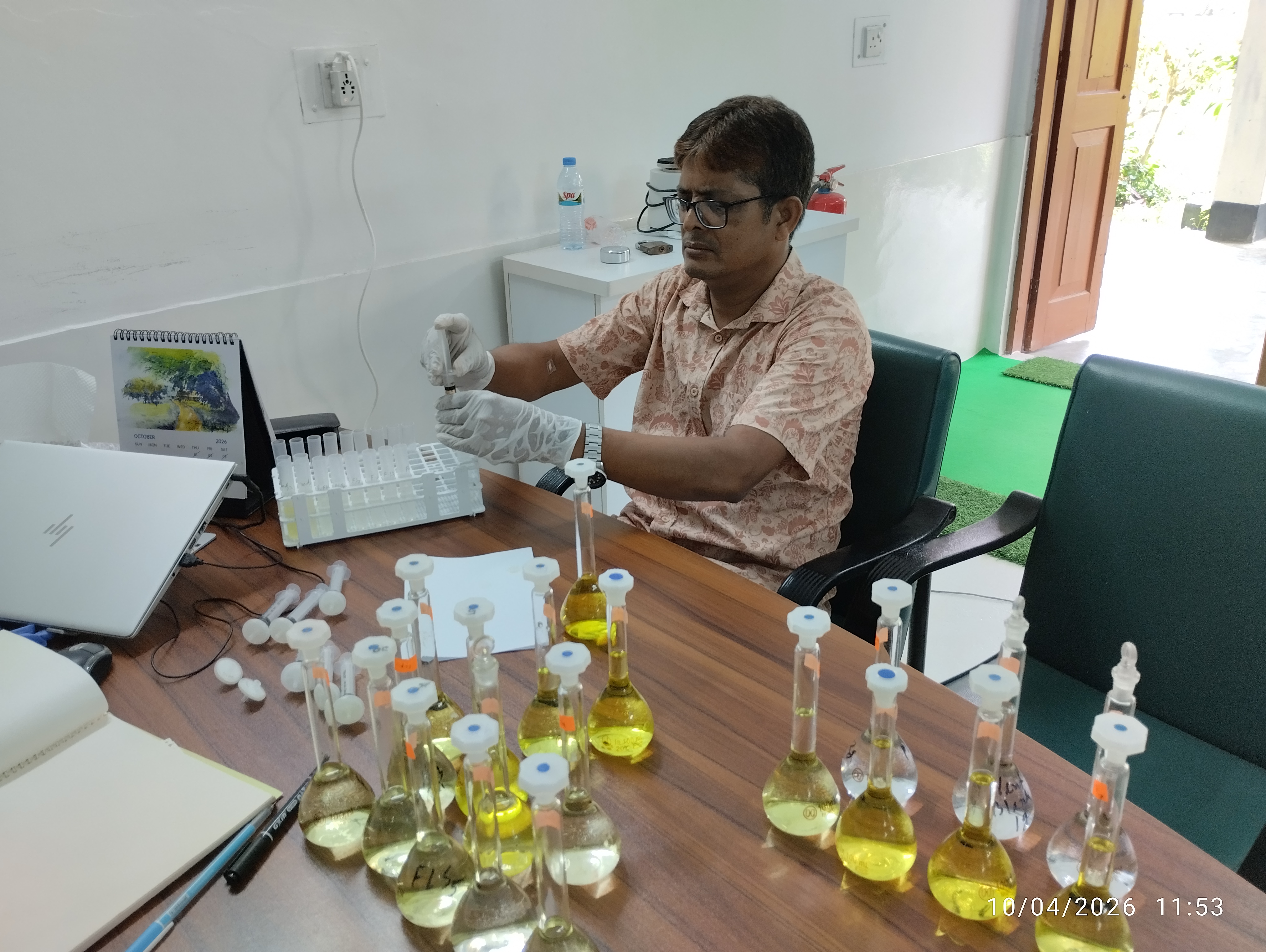 A PhD fellow from Institute of Environmental Science, RU is preparing samples for ICP-OES analysis